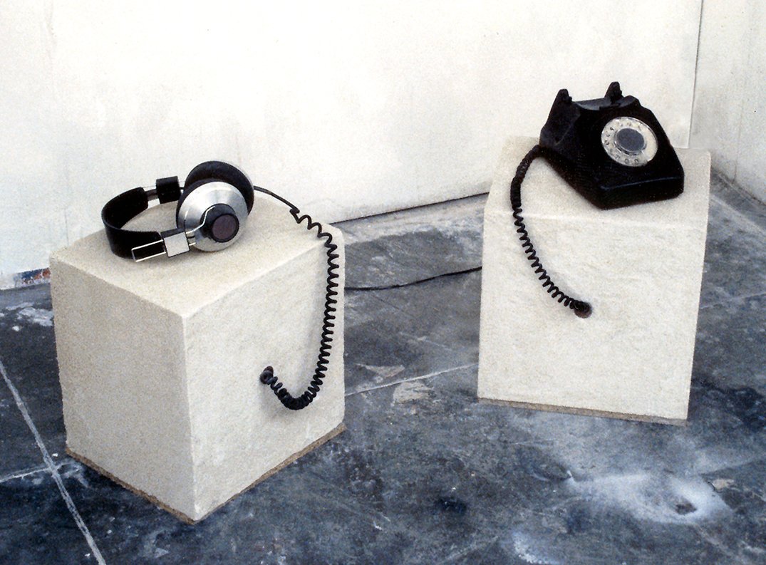 Isolation #1 and #2: Concrete blocks with headphones and telephone