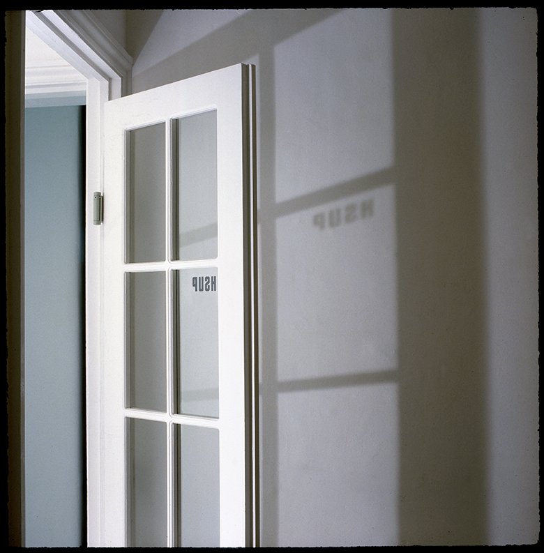 Paradoxical 'PUSH' sign on double swing door